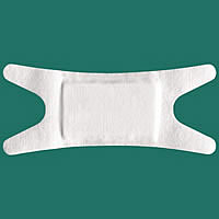 Adhesive non-woven wound dressing
